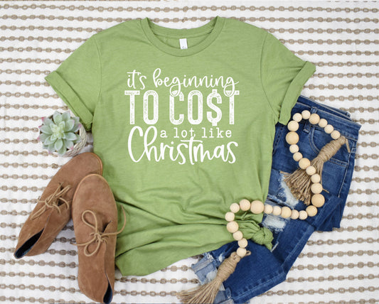 Wholesale It's Beginning to Cost a Lot Like Christmas Graphic Tee - Green Tee